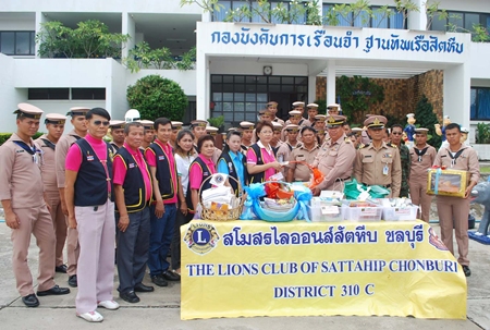 Sattahip Lions Club members donate spiritual books to officials to give to prisoners at the Sattahip Naval Base Penitentiary.
